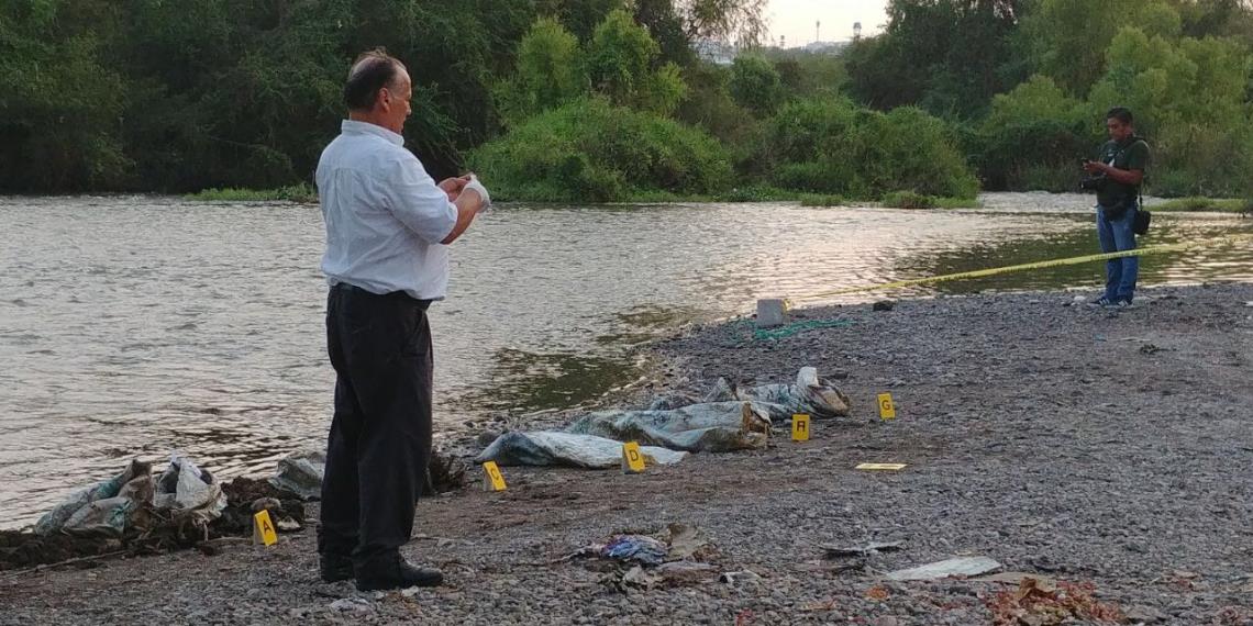 Restos de siete personas son hallados en costales en río Humaya