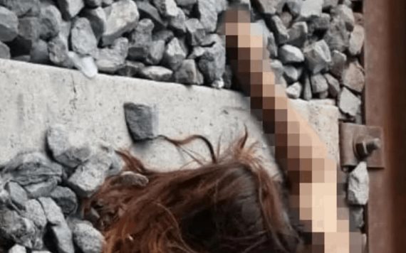 Arrojan el cuerpo de una mujer desnuda en las vías del tren