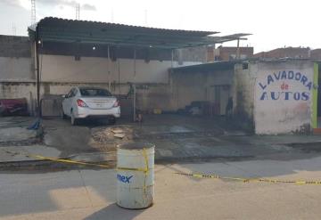 Ejecutan a dos personas en el interior de lavadora de autos en Tercer Milenio