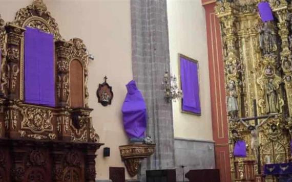 Cubren figuras femeninas en una iglesia de la CDMX para resaltar violencia contra mujeres