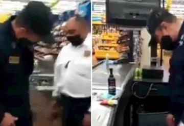 VIDEO: Descubren a policía intentando robar mercancía de un supermercado